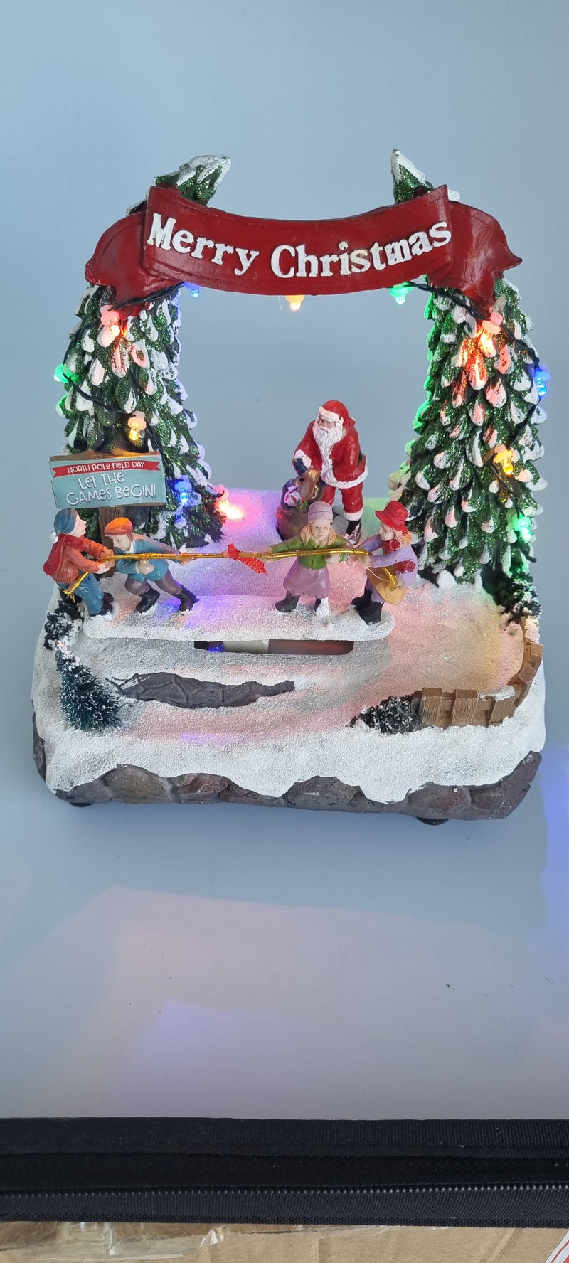 Animated santa playing with children toy