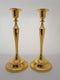 A SET OF TWO SINGLE GOLDEN CANDLE HOLDERS